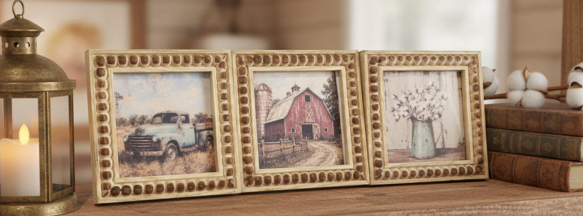 Three framed pictures on a checkered tablecloth with a white background