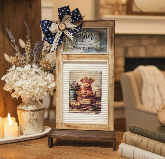Wooden picture frame with decorative elements on a white surface