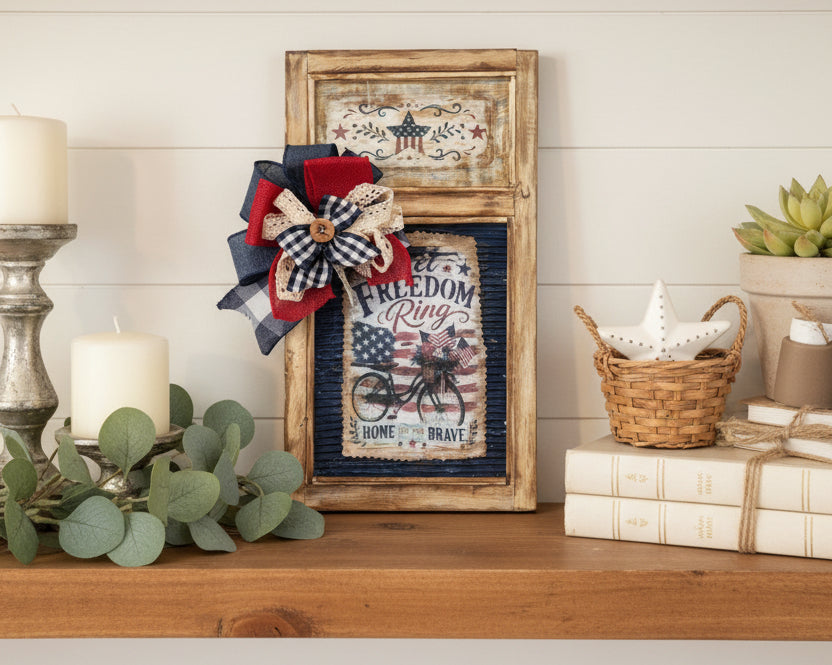Decorative box with patriotic-themed items including a flower and framed text on a white background.
