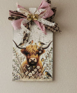 Hyland cow with bird friends